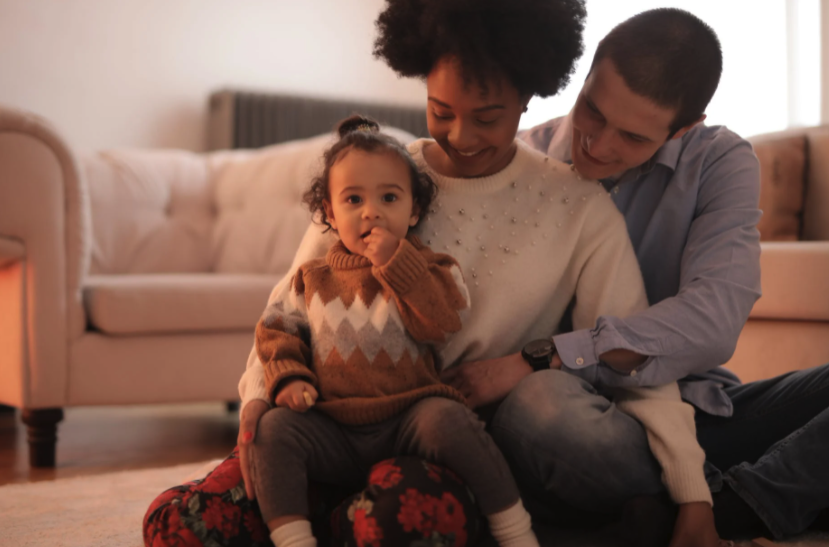 Parents Hugging their Child