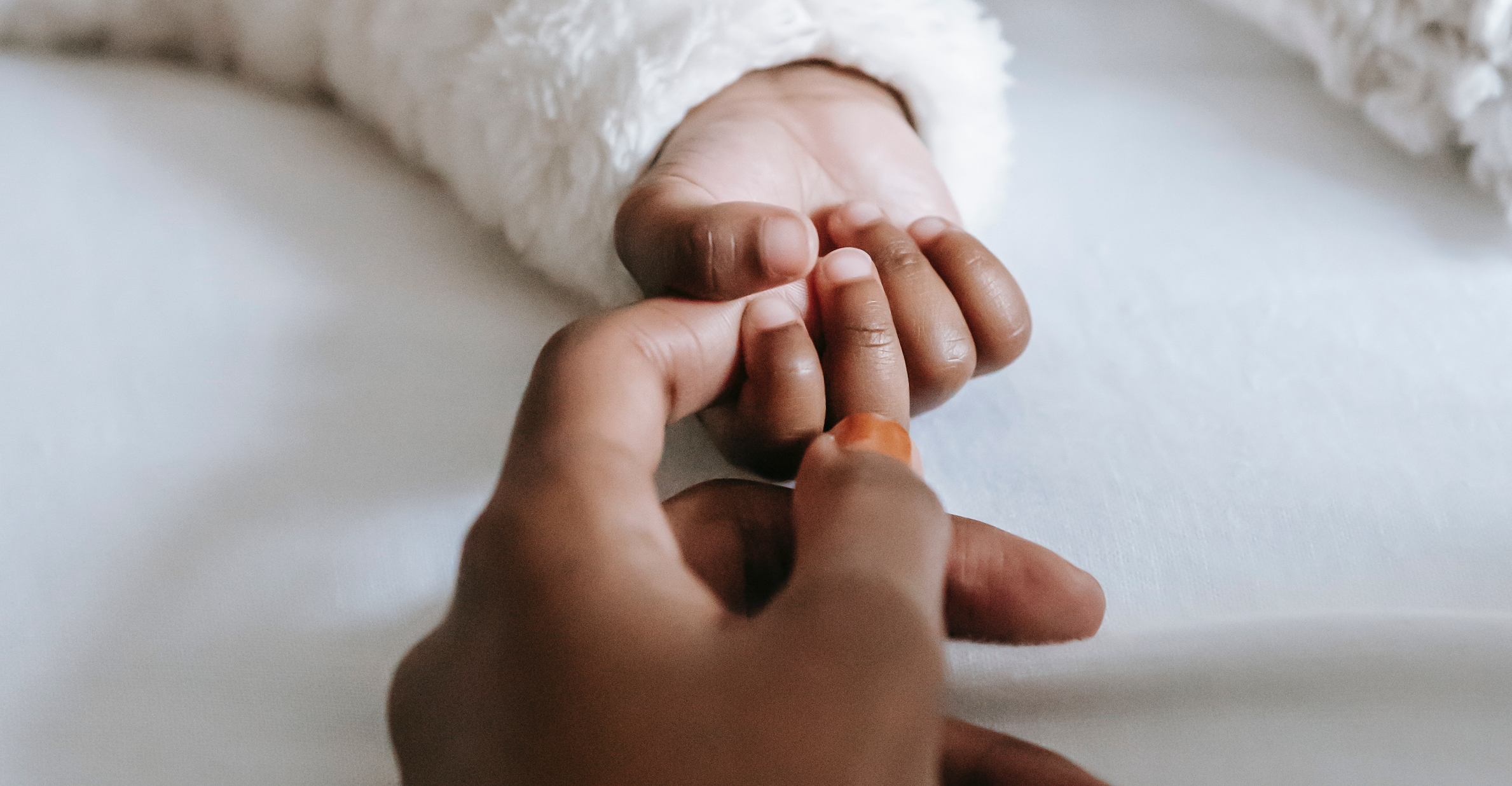 Mother and Baby Holding Hands