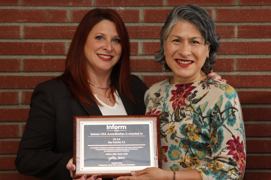Amy Latzer, 211 LA, COO and Maribel Marin. 211 LA ED, pose for a picture with InformUSA Award.png