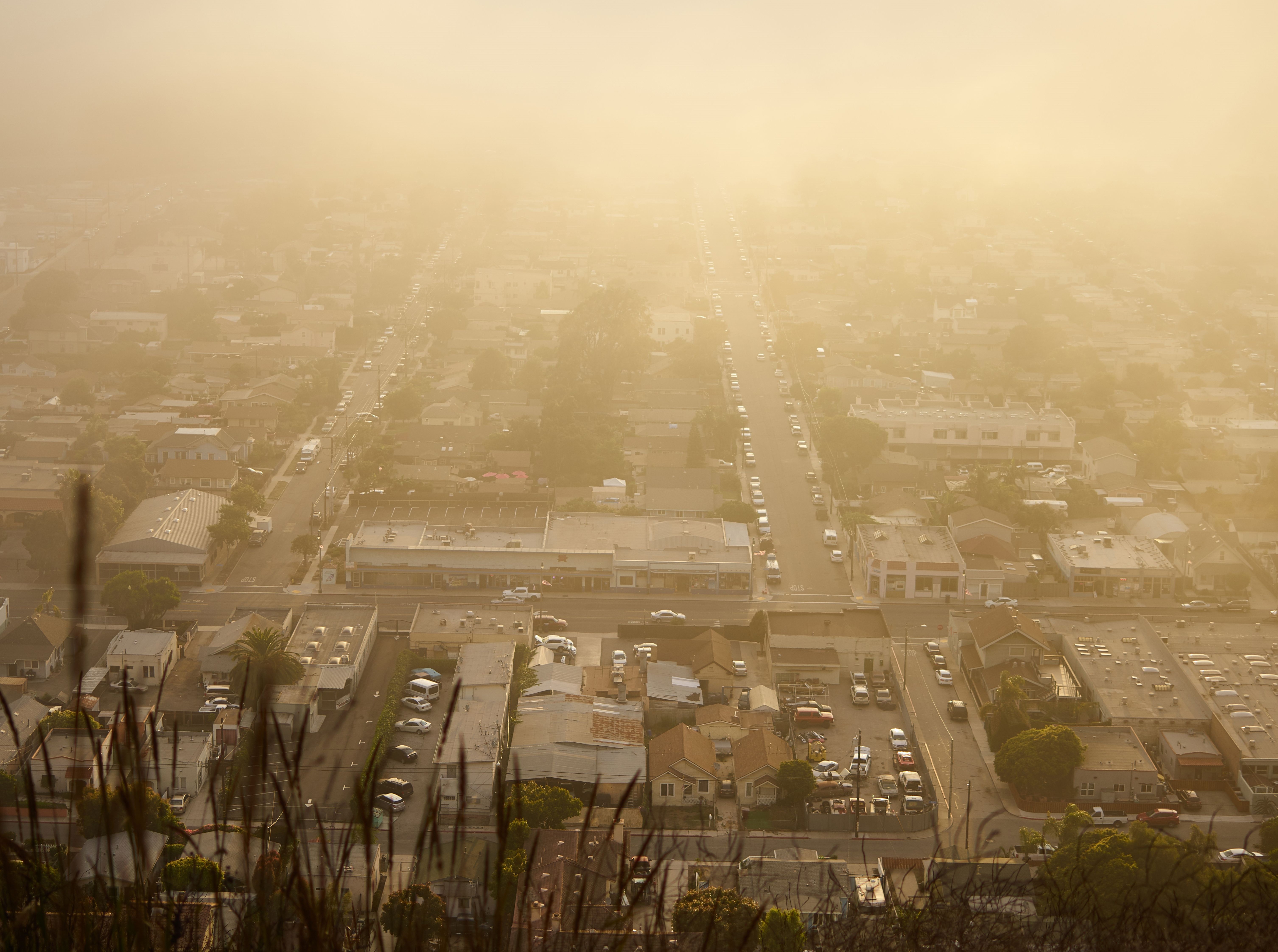 Smoke hovering over the community of houses