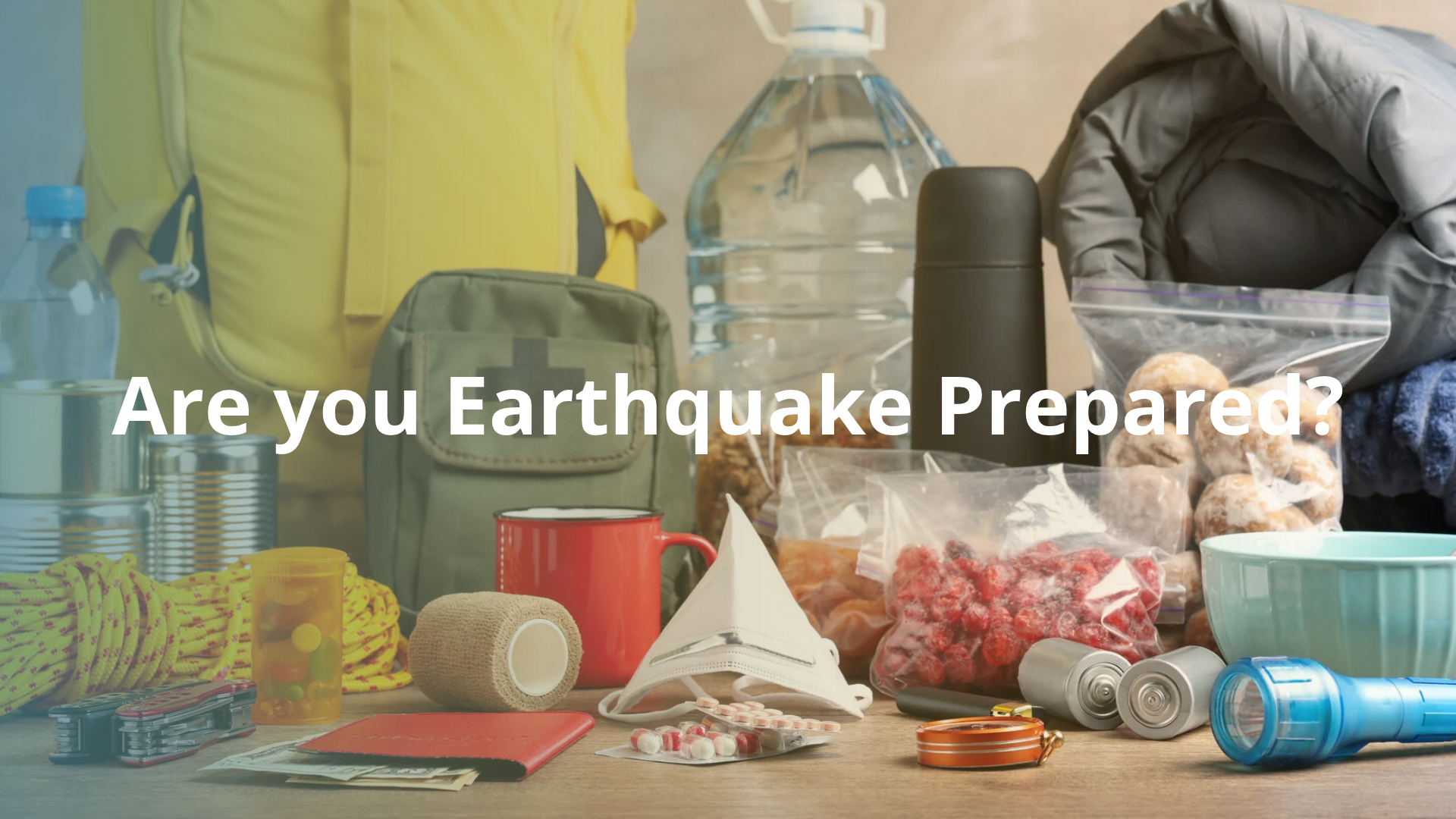 Are you earthquake prepared? (image includes canned food, water bottles, clothing, blanket and other disaster prepared items)