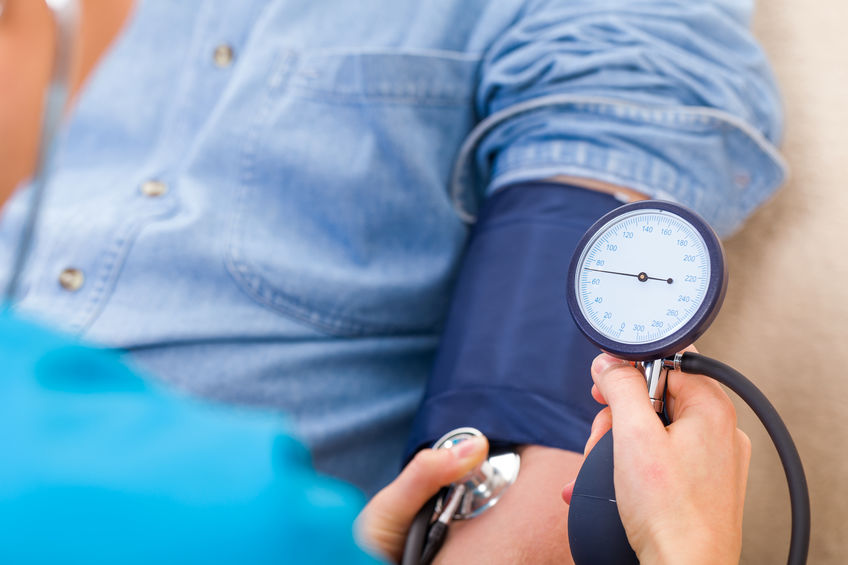 patient getting blood pressure taken
