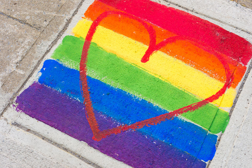 rainbow heart chalk drawing on sidewalk