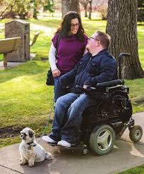 Caregiver with Patient in Wheelchair