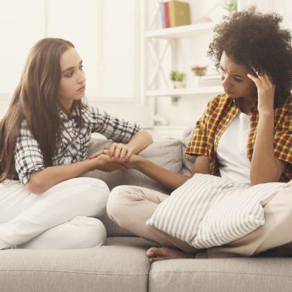 Young woman comforting a friend in distress