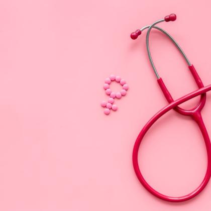 Stethoscope and pills in shape of female gender sign 