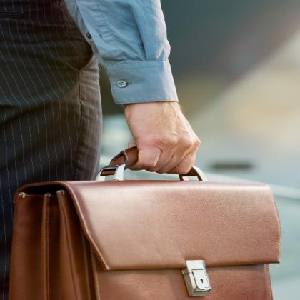 person holding briefcase