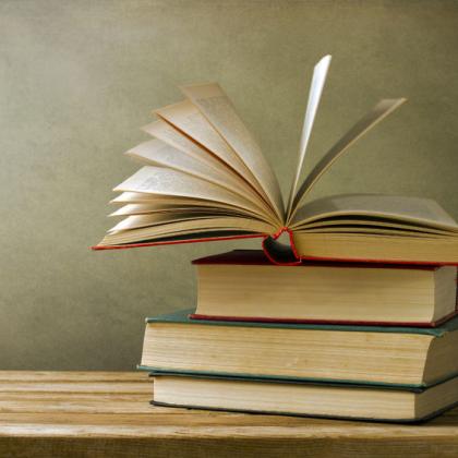 stack of books on a desk