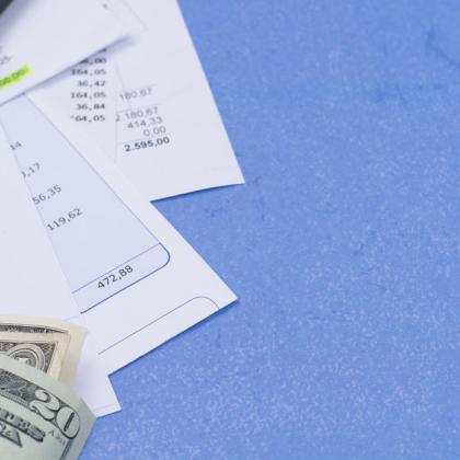 Image of bills and money on blue background
