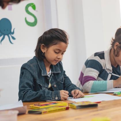 Children Coloring at School 