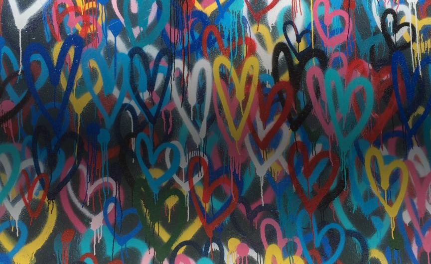 Heart wall mural with multicolored painted hearts