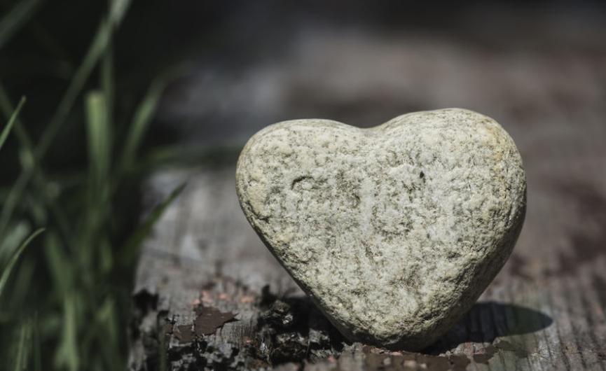 heart shaped stone on natural surface background