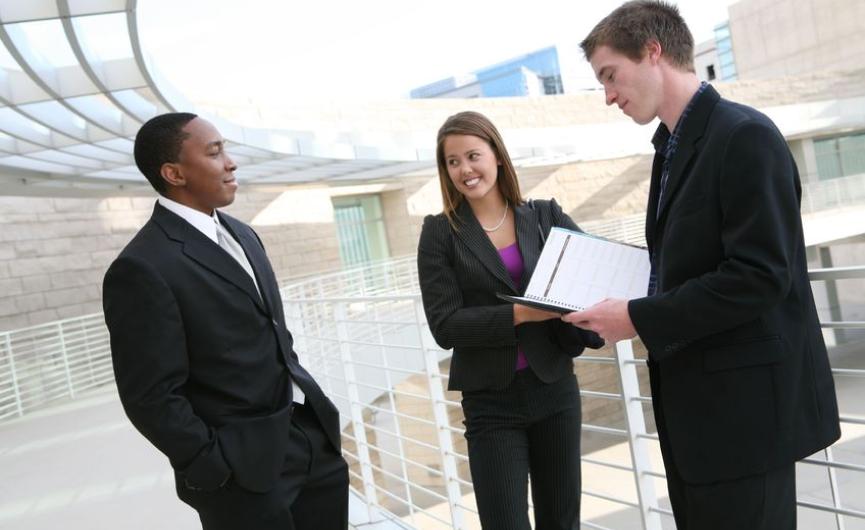 three young job seekers standing on a balcony