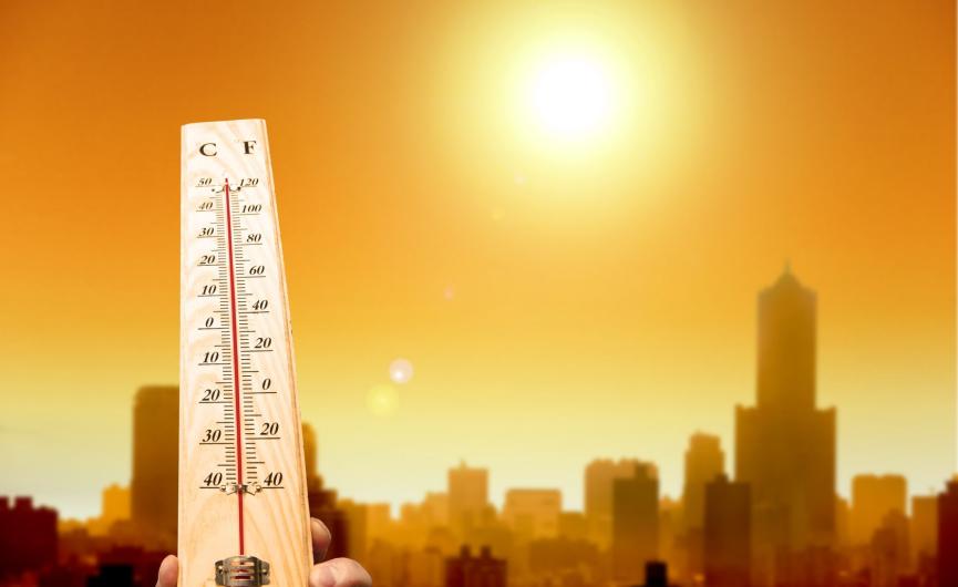 Image of Thermometer with City Background