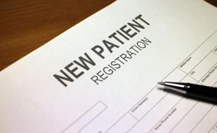 Paper on desk saying New Patient Registration