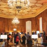 Expanded shot of the California Club with attendees listening to speaker